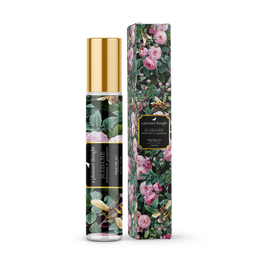 A 15ml bottle of A Pleasant Thought Madame perfume oil with ambrette and jasmine, featuring elegant packaging and a glass bottle.