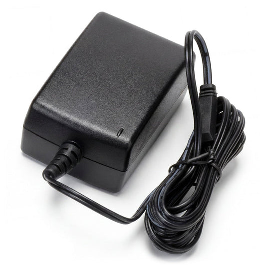 Black power adapter with a coiled cable on a white background