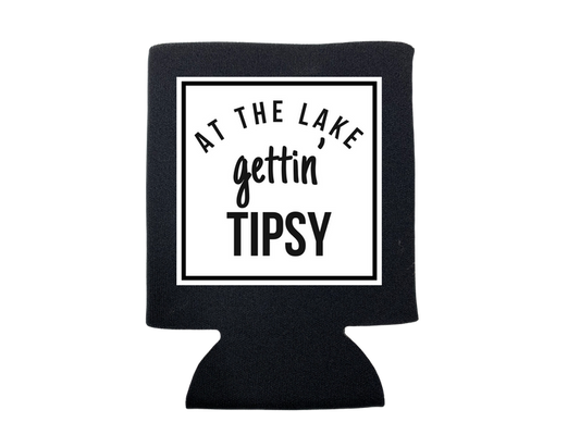 Blue neoprene koozie with "At the Lake Gettin' Tipsy" text, designed for keeping drinks cold, by dkhandmade.