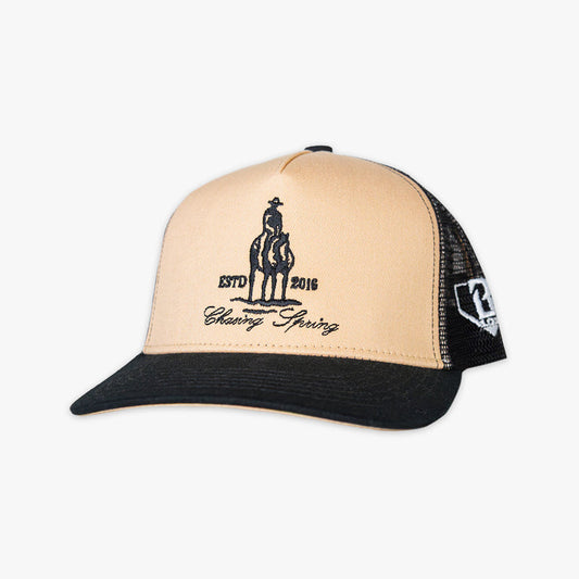 Beige and hat with a man on horse graphic and 'Chasing Spring' text on a white background