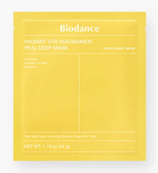 Yellow facial sheet mask packet labeled Biodance - Radiant Vita Niacinamide Real Deep Mask 1x, designed for brightening and Korean skincare routines.
