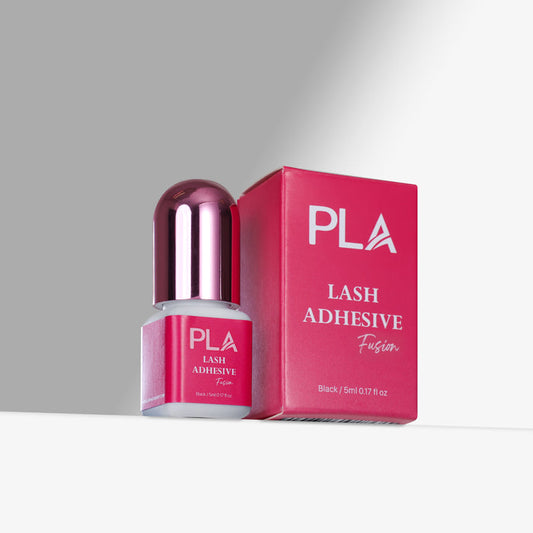 PLA lash adhesive bottle and packaging on a gray background