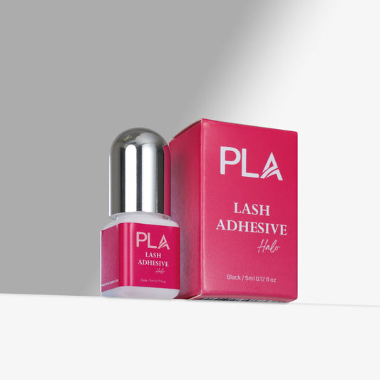 PLA Lash Adhesive bottle and packaging on a gray background
