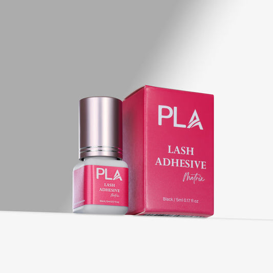 PLA lash adhesive bottle and packaging on a gray background