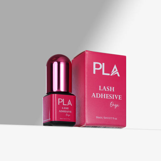 PLA lash adhesive bottle and packaging on a gray background