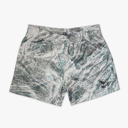 Marbled patterned shorts on a white background